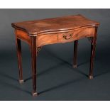 A George III mahogany serpentine tea table, folding top above a deep frieze with cockbeaded drawer,