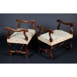 A pair of 19th century Italian walnut window seats, reeded arms carved with scrolling acanthus,