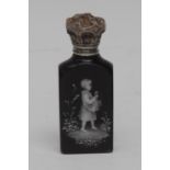 A Victorian Mary Gregory-type black glass and silver-coloured metal mounted scent bottle,