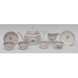 A Newhall ovoid teapot and cover, decorated with the Famille Rose palette with floral sprigs,