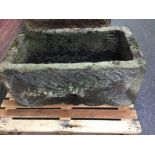 A hewn stone trough 47cm high x 94cm long x 59cm wide