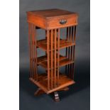 A Victorian walnut revolving bookcase, quite plain, shaped base, 112cm high, 47cm wide, c.