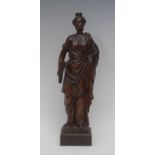 An 18th century carving, of a Classical lady holding a sheaf, she stands,