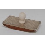 An Edwardian silver mounted desk blotter, engraved with fleur de Lys and reeded bands, ivory handle,