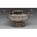 A Victorian silver half-fluted pedestal punch bowl, acanthus capped scroll handles,