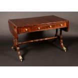 A post-Regency rosewood rounded rectangular sofa table,