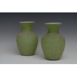 A pair of Victorian green textured satin glass ovoid vases, applied with ferns, 20cm high, c.