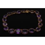 A nineteen stone amethyst necklace,
