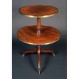 A Regency mahogany circular two-tier dumbwaiter, brass mounted graduated plateaux,