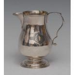 A George II silver sparrow beak baluster jug, scroll capped handle, gilt interior,