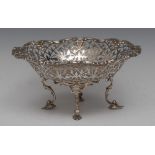 A George V silver pedestal basket, the sides pierced with stylised scrolls and leaves,