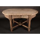 A Victorian Gothic Revival weathered oak rounded rectangular hall table,