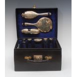 A George V gentleman's black leather travelling case, comprising hair brush,