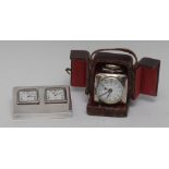 An early 20th century silver plated rounded square travelling alarm timepiece,