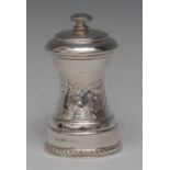 An Elizabeth II silver pepper grinder, chased with a band of C-scrolls and leaves,