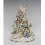 A Staffordshire porcelain tree trunk spill vase,