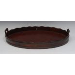 A 19th century two-handled mahogany serving tray, undulating gallery,