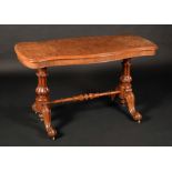 A Victorian walnut serpentine centre table, well-figured top with moulded edge,