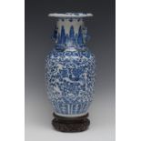 A Chinese ovoid vase, painted in underglaze blue with birds amongst scrolling foliage,