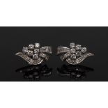 A pair of diamond earrings,