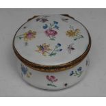 An 18th century gilt-metal mounted enamel circular table snuff box,