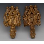 A pair of 17th century Italian giltwood cartouche shaped finials,