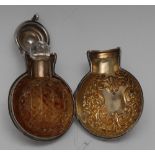 A Victorian silver cased moon shaped scent bottle, chased with scrolling foliage,