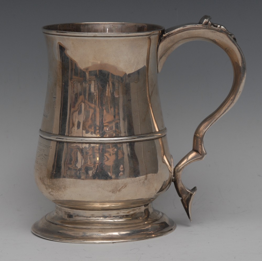 A George III silver bell shaped pint mug, moulded rim, three-quarter girdle,