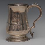 A George III silver bell shaped pint mug, moulded rim, three-quarter girdle,