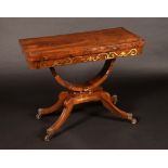 A Regency rosewood and brass marquetry rounded rectangular card table,