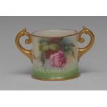 A Royal Worcester two-handled loving cup, painted with pink and yellow roses,