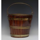 A George III brass bound mahogany oval peat bucket, swing handle, brass liner, 38cm wide, c.