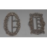 A Victorian silver shaped rectangular belt buckle, pierced and embossed with scrolling leaves,