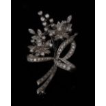 A diamond encrusted platinum floral spray brooch,