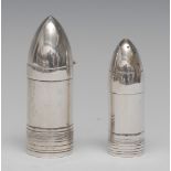 A Victorian silver novelty pepper and mustard, as bullets or shells, the mustard with hinged cover,