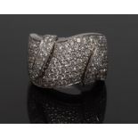 A pave diamond encrusted ring, shaped multi-layered crown encrusted with diamonds,
