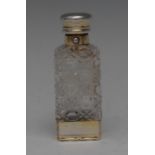 A Victorian silver-gilt and cut glass combination scent bottle and vinaigrette, hinged domed cover,