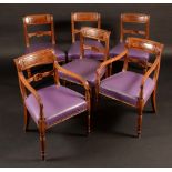 A set of six late George III mahogany dining chairs,