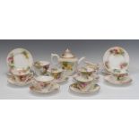 A Royal Worcester James Hadley part tea service, comprising teapot and cover, milk jug, sugar bowl,