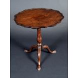 A George III mahogany and fruitwood tripod occasional table, piecrust top on birdcage support,