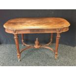 An early 19th century bowed rectangular library table, quarter-veneered crossbanded top,