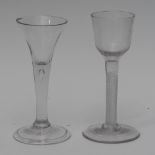 A George II trumpet shaped wine glass, drawn stem with tear inclusion, folded foot, 15cm high, c.