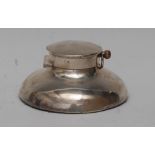 An unusual Edwardian silver capstan inkwell, the hinged cover set with open faced pocket watch, 11.