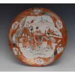 A Japanese Kutani charger, decorated with figures and fence, the border with geometrical shapes,