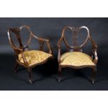 A pair of late Victorian drawing room chairs,