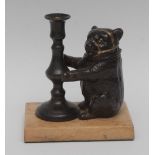 A 19th century patinated combination smoker's table-top fancy, the vesta as a tamed bear,