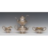 A George IV Rococo Revival silver pedestal tea and coffee pot, rose finials, hinged domed covers,