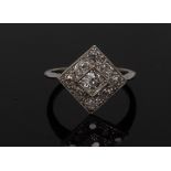 A diamond panel ring, square platform panel inset with nine round cut diamonds,