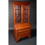 A George III Revival mahogany bureau bookcase,