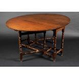 An 18th century style oak gateleg oval table, bobbin turned legs and stretchers, 77cm high,
